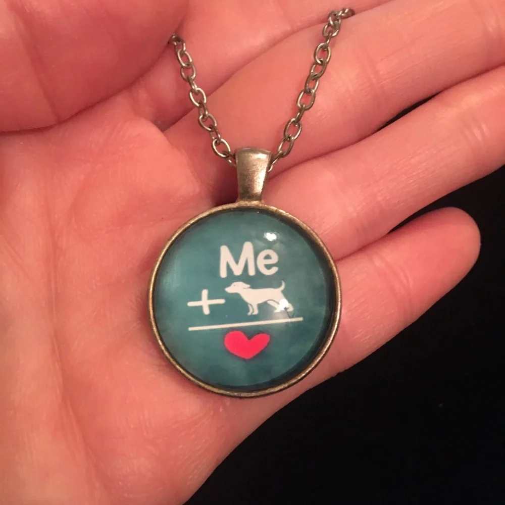 Charming Teal Necklace with Heart and Dog Design